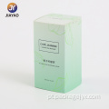 Design elegante de caixa de perfume com folhas verdes